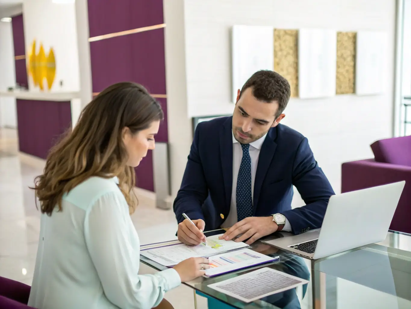 A professional financial advisor discussing wealth plans with a client in a modern office setting, representing personalized wealth management services.